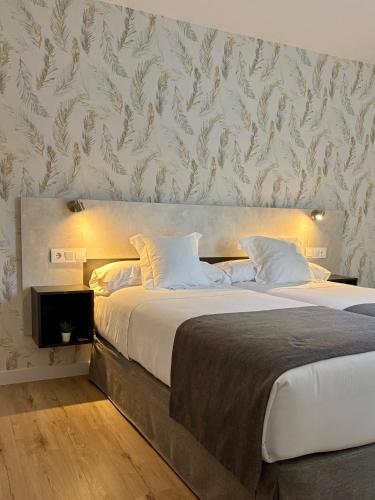 Ένα ή περισσότερα κρεβάτια σε δωμάτιο στο Apartamentos Adarve