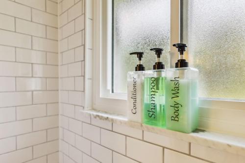a window sill with three bottles of detergent at CVNP Winter Getaway - 5 mins to Boston Mills Ski in Northfield