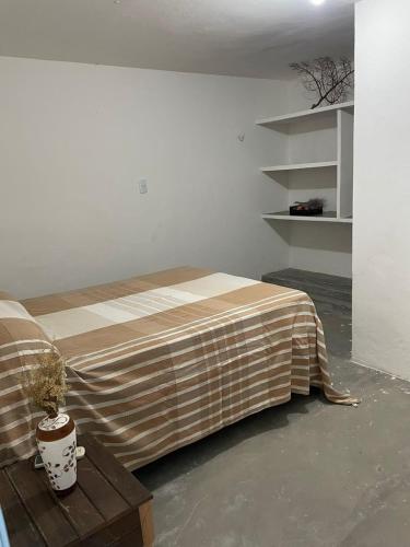 Una cama o camas en una habitación de Suíte Aconchego