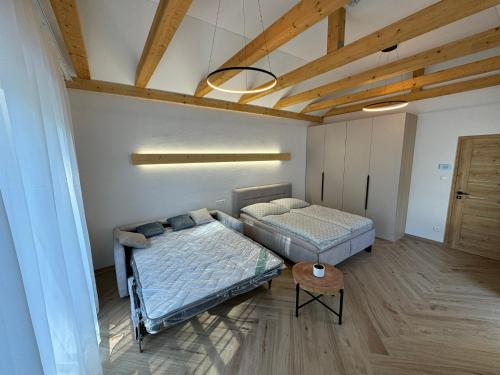 Ένα ή περισσότερα κρεβάτια σε δωμάτιο στο Daily Living - Apartmán v centre Varína