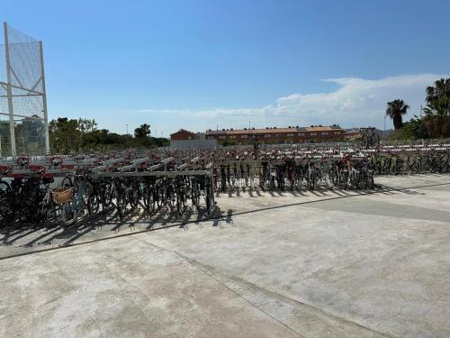 a row of bikes parked in a parking lot at Luxury Canet in Canet de Berenguer