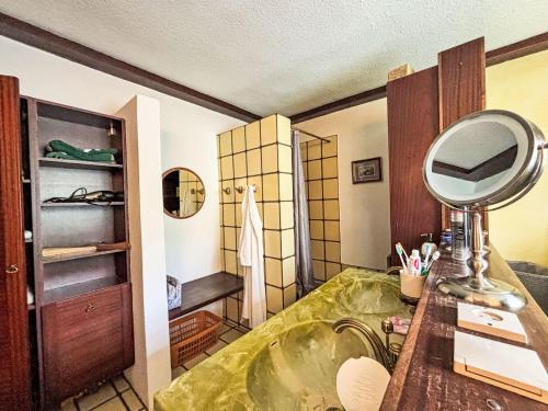 a bathroom with a sink and a mirror on a counter at Holiday Home Haus Sophie by Interhome in Schladming