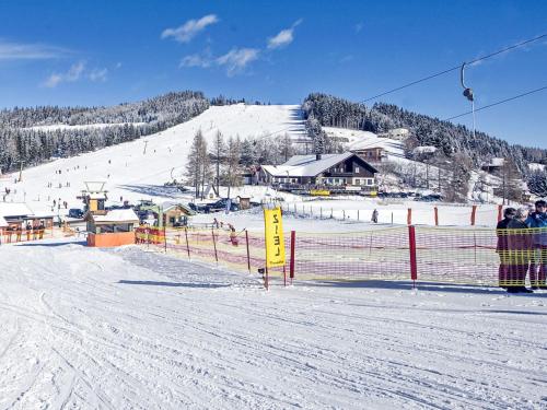 a ski slope with a fence and a ski resort at Apartment Paulsberg by Interhome in Sankt Paul