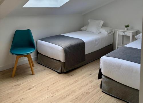 Ένα ή περισσότερα κρεβάτια σε δωμάτιο στο Apartamentos Adarve