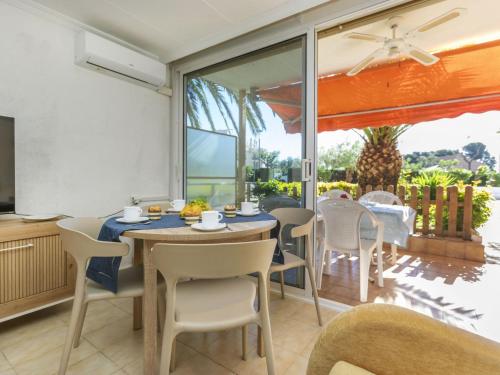a dining room with a table and chairs at Apartment Arernal by Interhome in Hospitalet de l'Infant