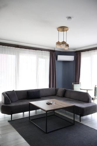 a living room with a couch and a coffee table at Centrum Residence in Ankara