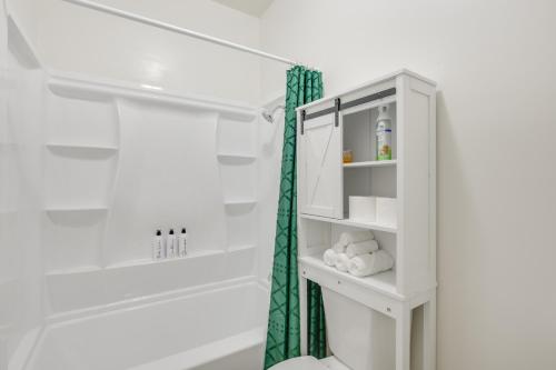 a white bathroom with a white shower curtain at Golden Hill Gem 2 Mi to Gaslamp Quarter - Dogs OK! in San Diego