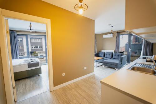 a room with a kitchen and a living room at Centrum Residence in Ankara
