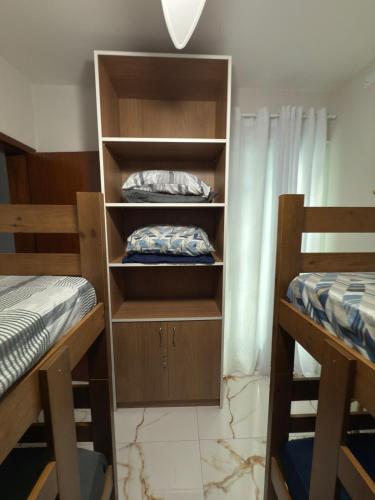 Ένα ή περισσότερα κρεβάτια σε δωμάτιο στο Recanto Trajano