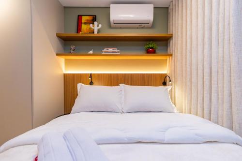 Postel nebo postele na pokoji v ubytování Studio Moderno e Aconchegante no All Batel-BAT0721