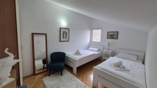 Postel nebo postele na pokoji v ubytování Egon Apartments