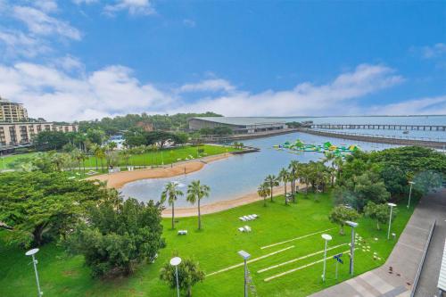 a view of a park with a body of water at Picturesque Waterfront Lagoon Views Top Lvl & BBQ in Darwin