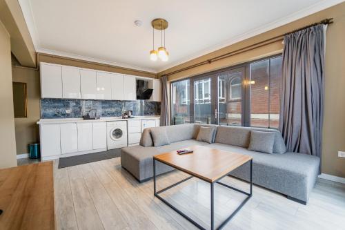 a living room with a couch and a table at Centrum Residence in Ankara