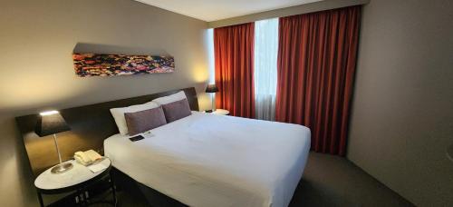 Ein Bett oder Betten in einem Zimmer der Unterkunft Pavilion On Northbourne