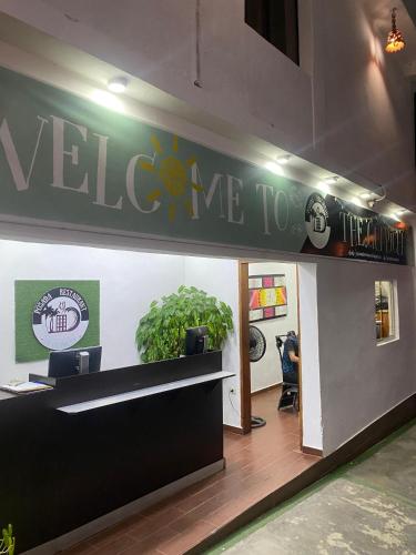 a lobby with a welcome to sign on the wall at Posada Restaurant La Guaricha in Catia La Mar