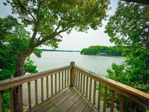 a wooden deck with a view of a lake at Treetop- Timberline Terraceunit29- Four Seasons in Four Seasons