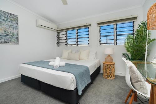 a bedroom with a large bed and a window at Spacious Beachside Retreat Plunge Pool & Patio in Larrakeyah