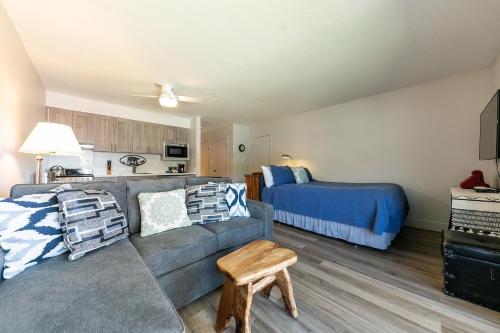 a living room with a couch and a bed at 244 Bldg C condo in Truckee