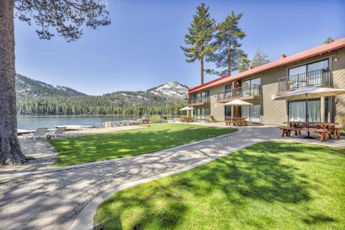 a building with a picnic table next to a lake at 244 Bldg C condo in Truckee