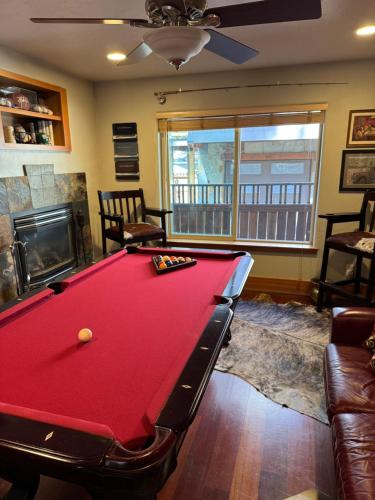 a living room with a pool table and a fireplace at Lake Tahoe Luxury Guest Quarters in South Lake Tahoe