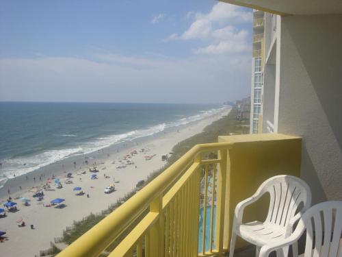 a balcony with a view of a beach at Gorgeous Oceanfront 3 Bedrooms Condo Sleeps up to10 people - Initial supply of Linens Included in Myrtle Beach