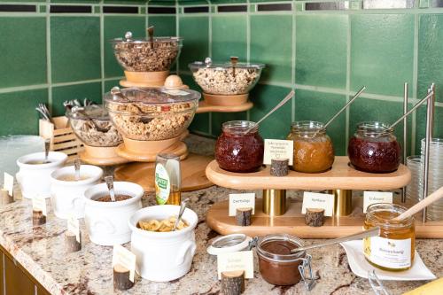 a display of jars of food on a counter at Gästehaus Hinterponholz in Ramsau