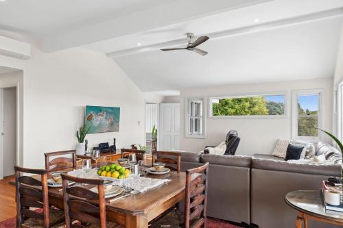 a living room with a table and a couch at Urunga Magic 1A in Urunga