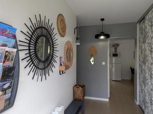 a hallway with a mirror on the wall at Gîte au Moulin: confort moderne avec terrasse et WIFI - FR-1-653-271 in Saint-Maurice-des-Lions