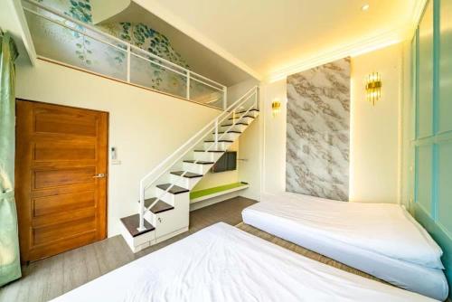 Una cama o camas en una habitación de 慕樂 游泳池獨棟羅東夜市