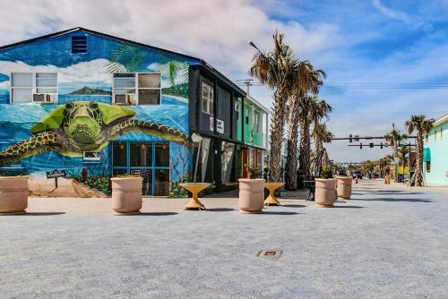 a mural of a turtle on the side of a building at Dolphin Cove 1 block from the Beach in Cocoa Beach