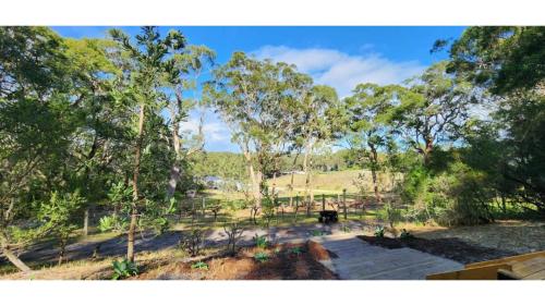 a view of a park with trees in the background at Sunset Vine at Wonganella Estate 2 by Tiny Away in Bobs Farm