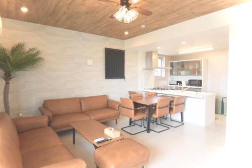 a living room with a couch and a table at at60percent in Miyako-jima
