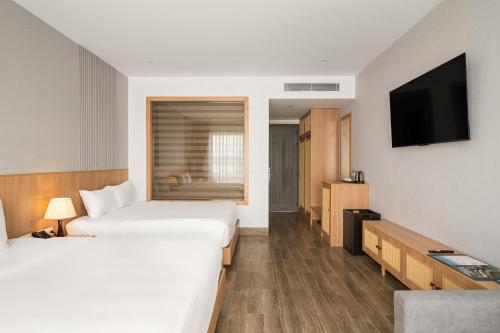 Postel nebo postele na pokoji v ubytování Quy Nhon Sea Resort