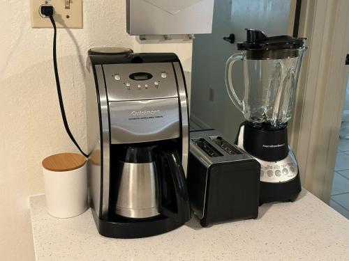 a coffee maker and a blender on a counter at Sweet Spot in Pharr in Pharr
