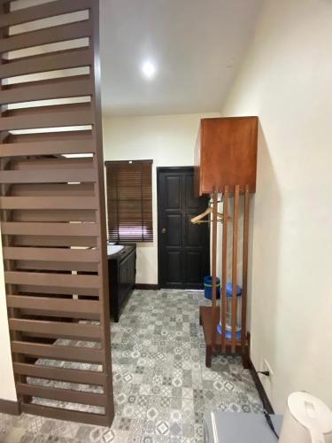 a stairwell in a room with a bathroom at Park & Pool Resort in Nong Khai