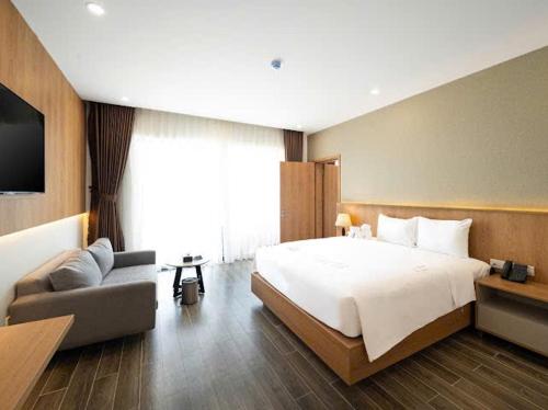 Postel nebo postele na pokoji v ubytování Quy Nhon Sea Resort