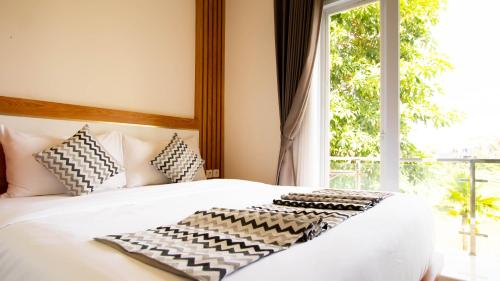 Ένα ή περισσότερα κρεβάτια σε δωμάτιο στο Padi Villa Canggu