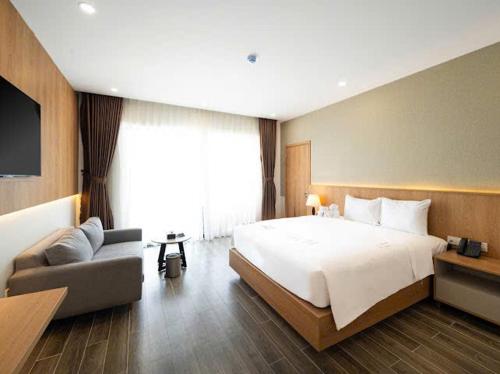 Postel nebo postele na pokoji v ubytování Quy Nhon Sea Resort