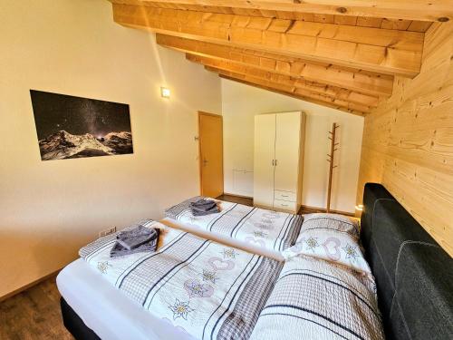 a bedroom with a bed in a room at Chalet Eigernordwand in Grindelwald