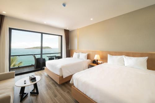 Postel nebo postele na pokoji v ubytování Quy Nhon Sea Resort