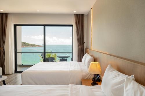 Postel nebo postele na pokoji v ubytování Quy Nhon Sea Resort