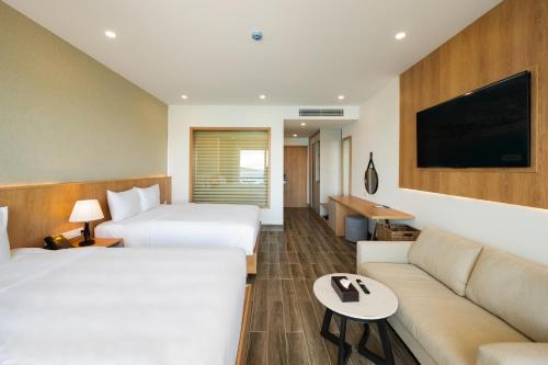 Postel nebo postele na pokoji v ubytování Quy Nhon Sea Resort