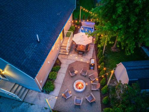 an overhead view of a patio with a table and chairs at Cedar Point, Kalahari, Sports Force, Hot tub, Fire pit, EV, Pets, Beach, Fireplace, Park in Huron