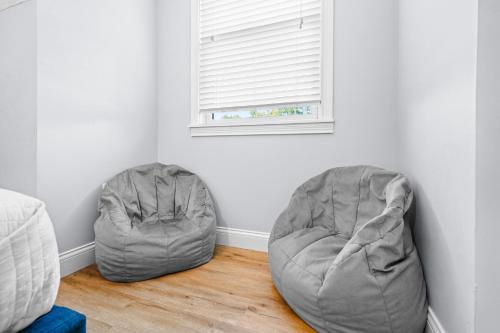 two bean bags in a room with a window at Cedar Point, Kalahari, Sports Force, Hot tub, Fire pit, EV, Pets, Beach, Fireplace, Park in Huron