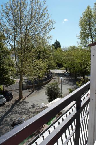 a view of a park from a balcony at Hotel Lux in Cesenatico