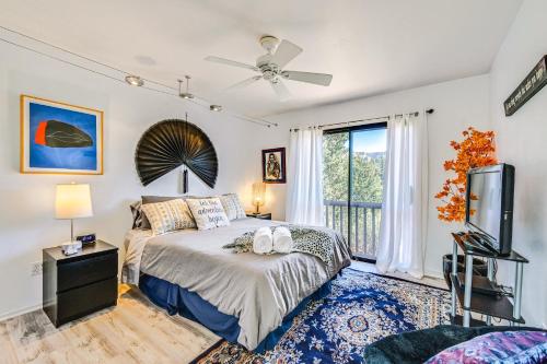 a bedroom with a bed and a flat screen tv at Sedona Retreat Central & Cozy Red Rock Views in Sedona