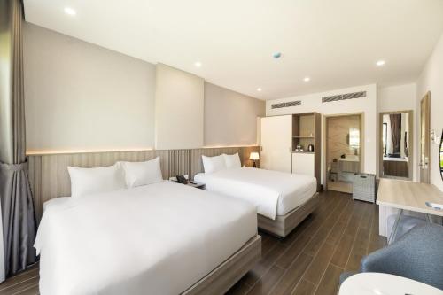 Postel nebo postele na pokoji v ubytování Quy Nhon Sea Resort