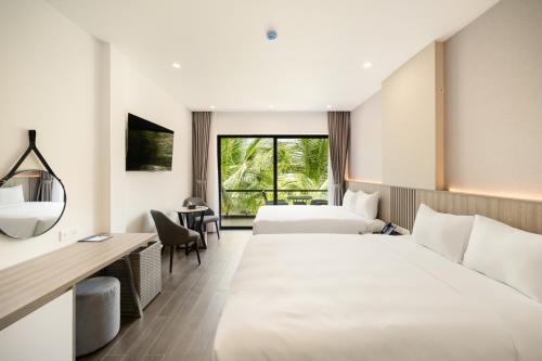 Postel nebo postele na pokoji v ubytování Quy Nhon Sea Resort