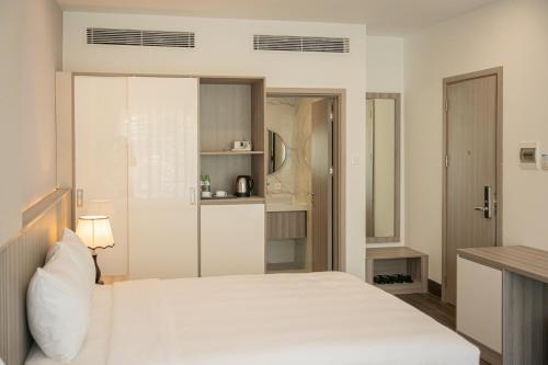 Postel nebo postele na pokoji v ubytování Quy Nhon Sea Resort