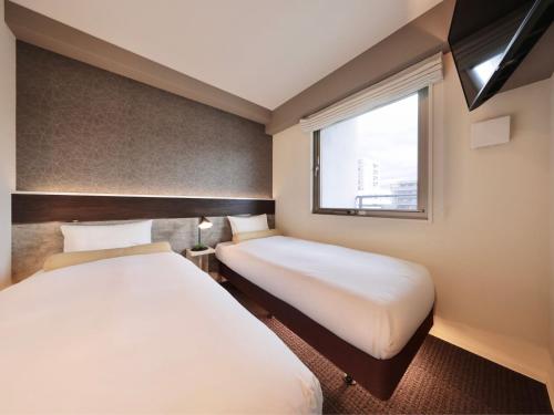 Ένα ή περισσότερα κρεβάτια σε δωμάτιο στο Dotonbori Crystal Hotel II - Vacation STAY 90067v